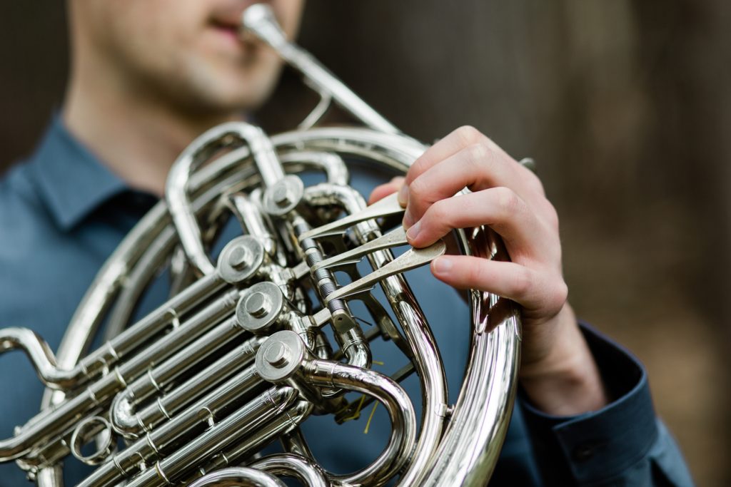 french horn, musician, male, headshot